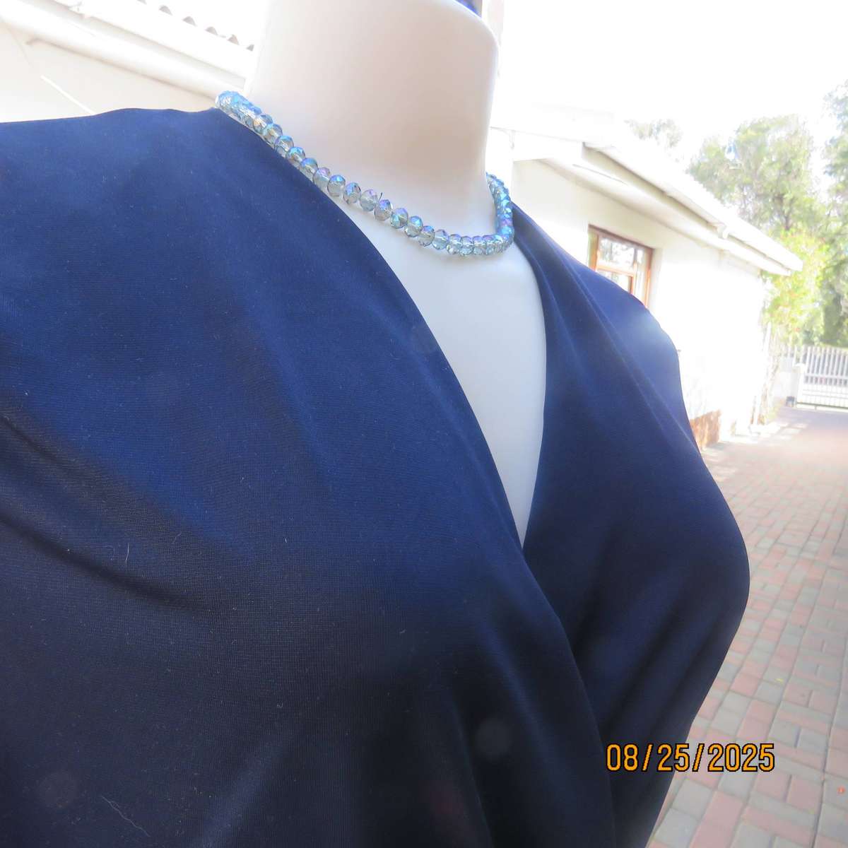 Navy stretch polyester peplum slip over top size 34. cross over bust.