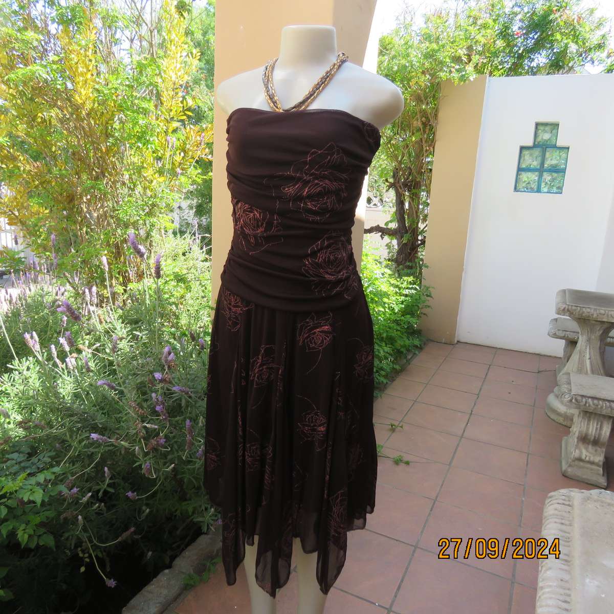 Glamour brown strapless dropped waist dress. Asymmetrical seamline. Bold glam roses.Size 34.