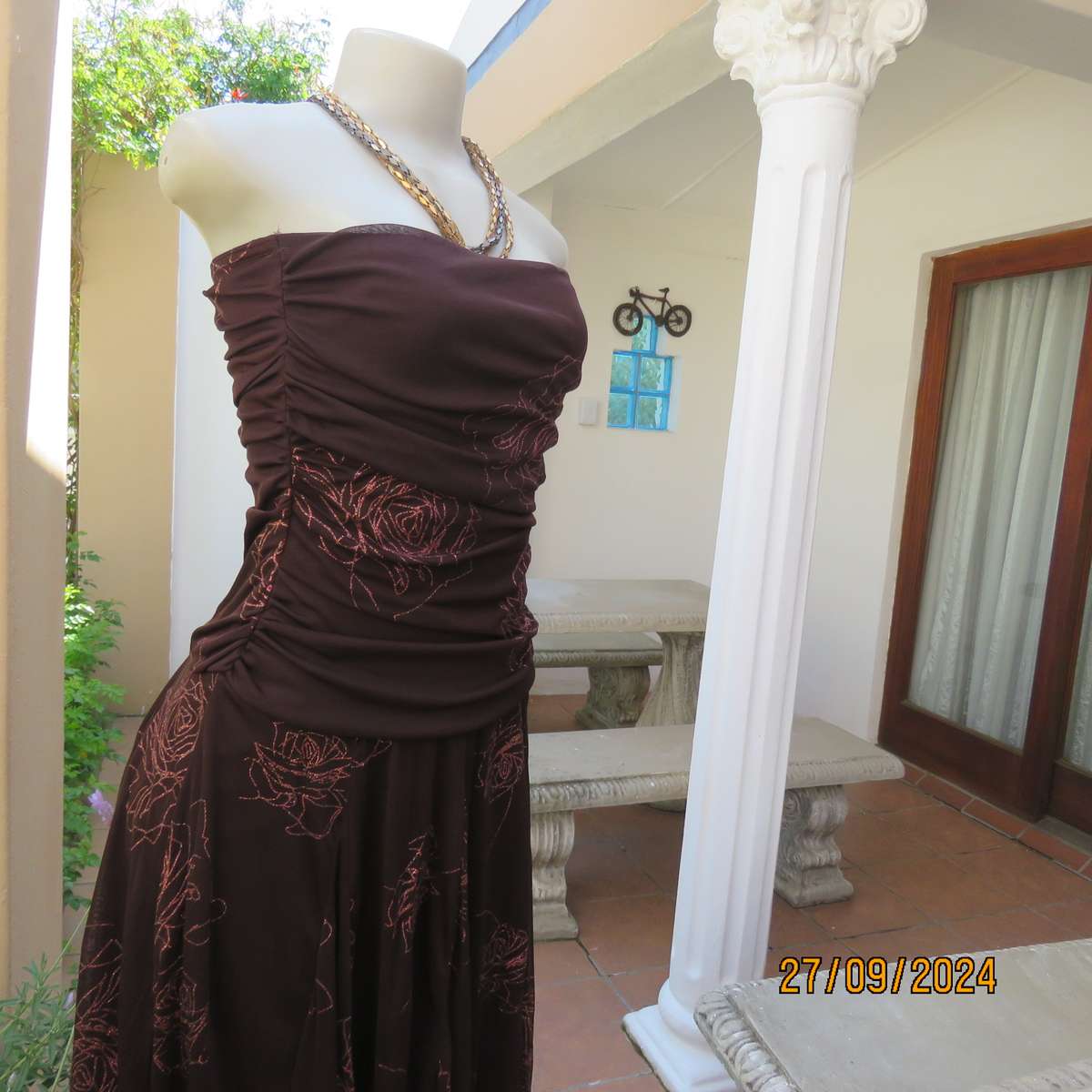 Glamour brown strapless dropped waist dress. Asymmetrical seamline. Bold glam roses.Size 34.