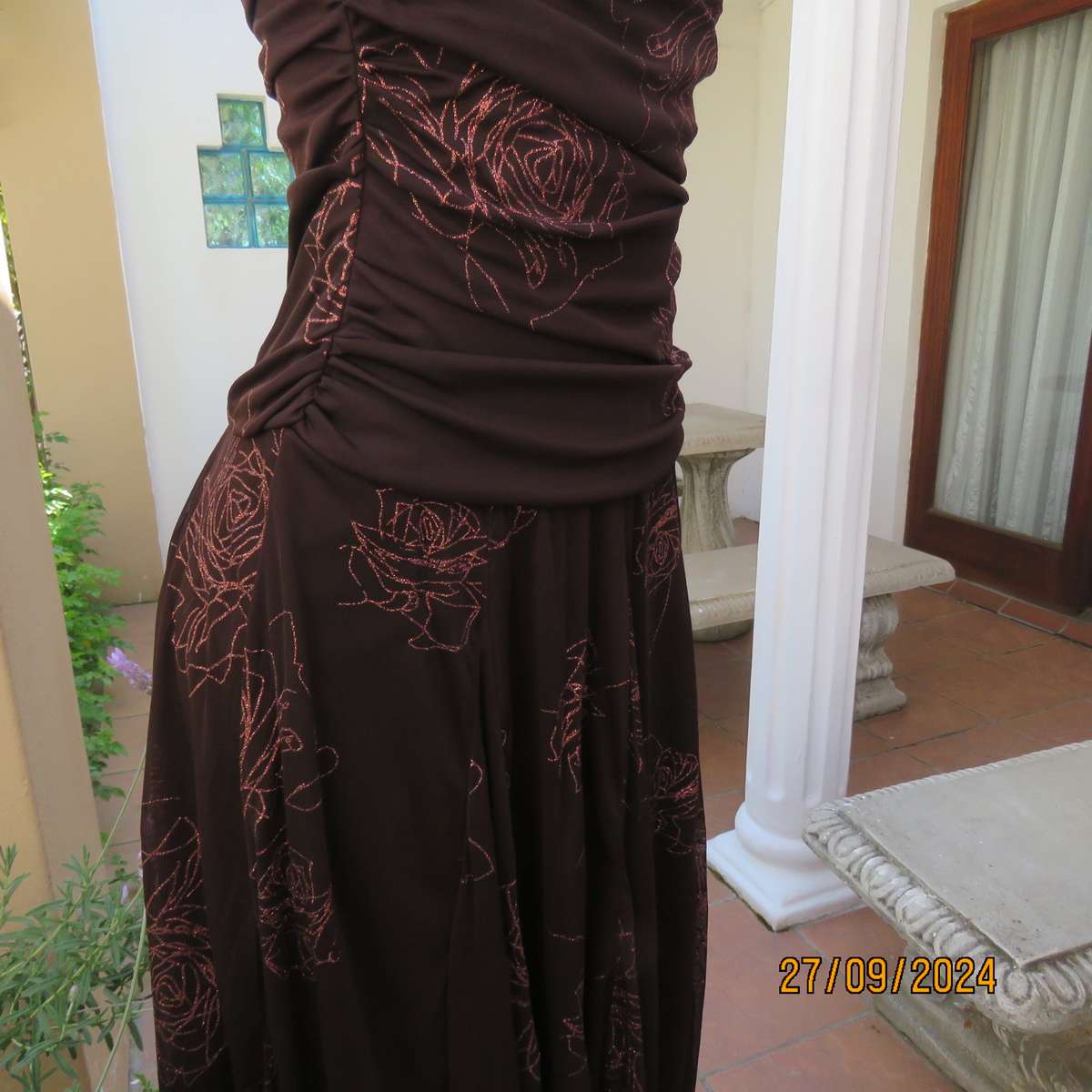 Glamour brown strapless dropped waist dress. Asymmetrical seamline. Bold glam roses.Size 34.