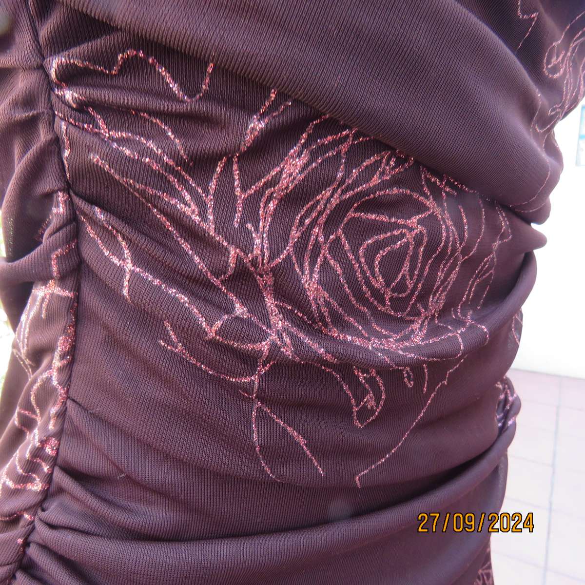 Glamour brown strapless dropped waist dress. Asymmetrical seamline. Bold glam roses.Size 34.