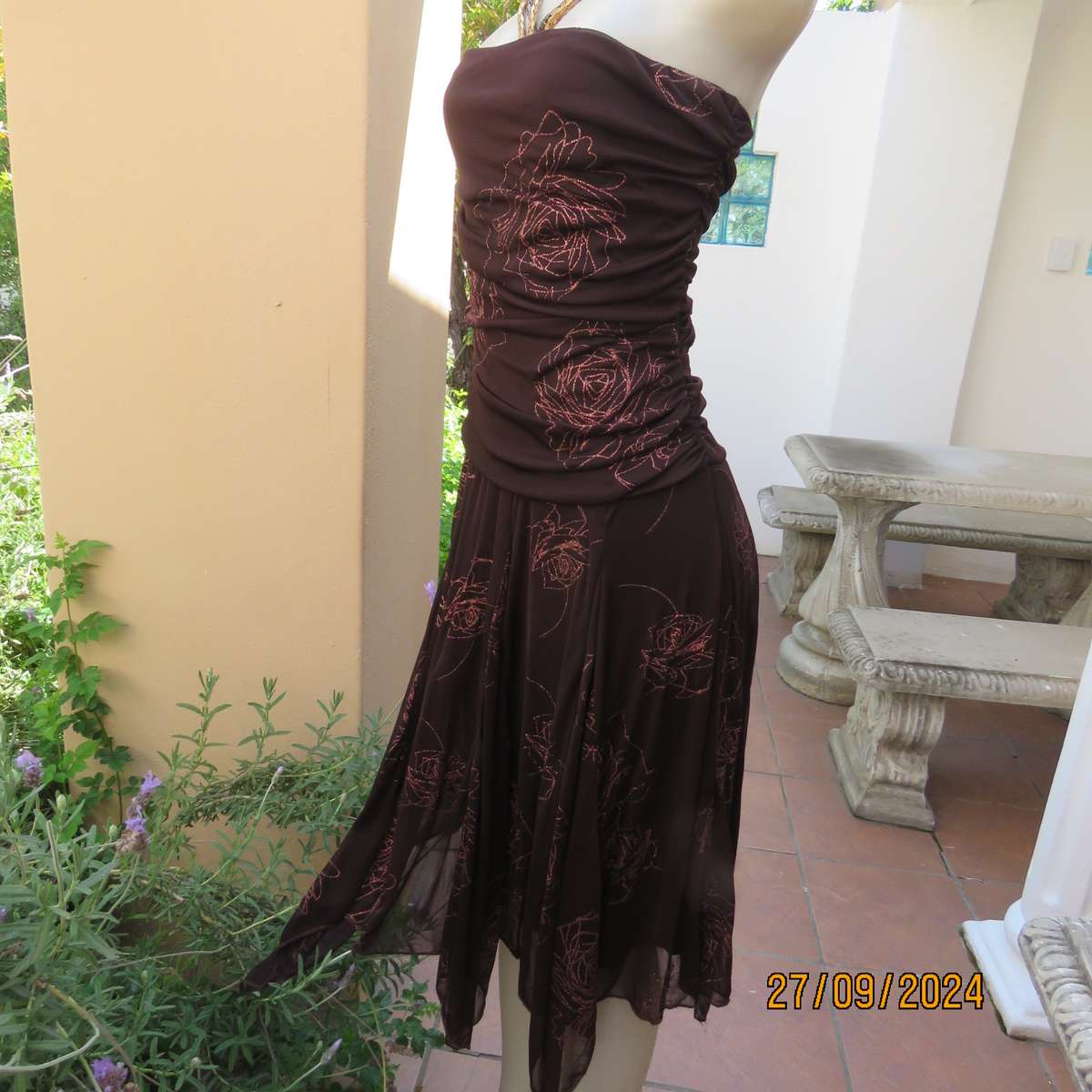 Glamour brown strapless dropped waist dress. Asymmetrical seamline. Bold glam roses.Size 34.