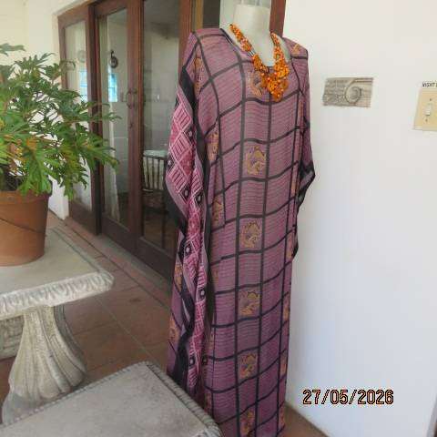 Maxi slip-over dress in large block pattern mulberry pink polyester with black. Free size