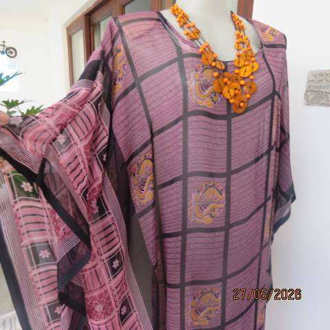 Maxi slip-over dress in large block pattern mulberry pink polyester with black. Free size