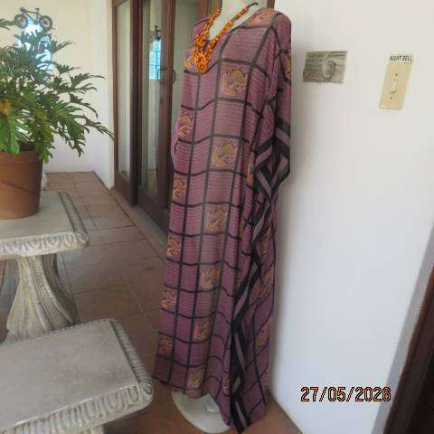 Maxi slip-over dress in large block pattern mulberry pink polyester with black. Free size