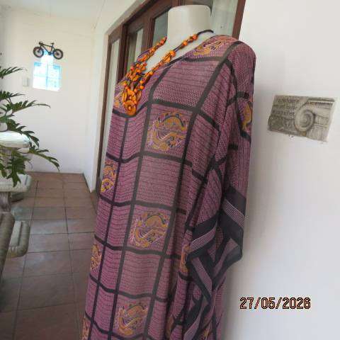 Maxi slip-over dress in large block pattern mulberry pink polyester with black. Free size