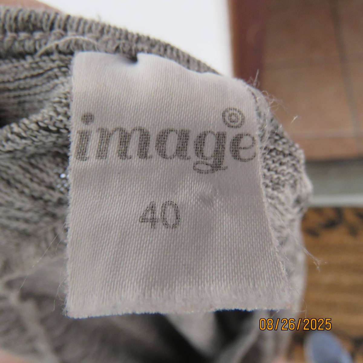 Mottled grey long sleeve slip over long sleeve woven stretch polyester top size 40.