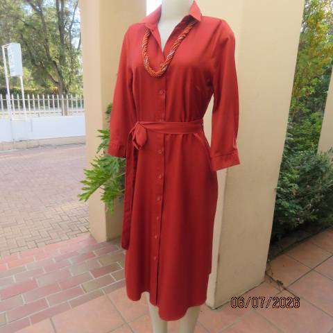 Rust colour button-down long sleeve polyester dress with open collar and fabric belt, size 34