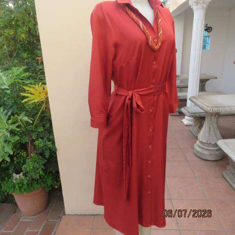 Rust colour button-down long sleeve polyester dress with open collar and fabric belt, size 34