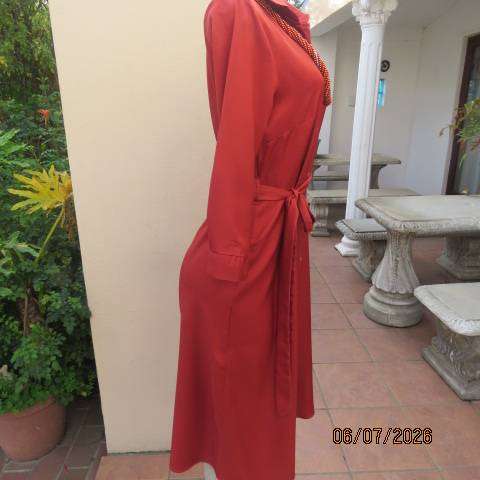 Rust colour button-down long sleeve polyester dress with open collar and fabric belt, size 34