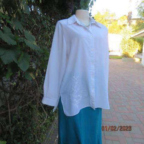 White high quality long sleeve textured polyester blouse button down .Front embroidery. Size 42
