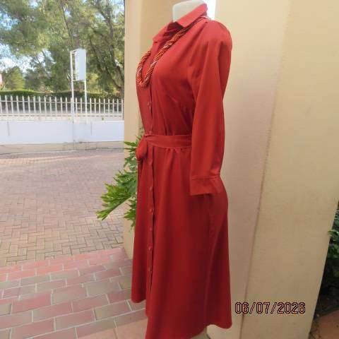Rust colour button-down long sleeve polyester dress with open collar and fabric belt, size 34