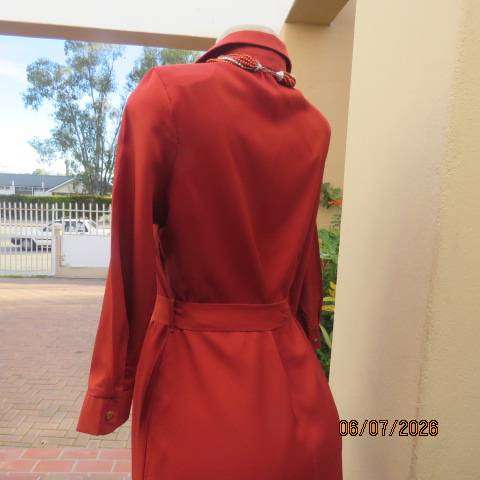 Rust colour button-down long sleeve polyester dress with open collar and fabric belt, size 34
