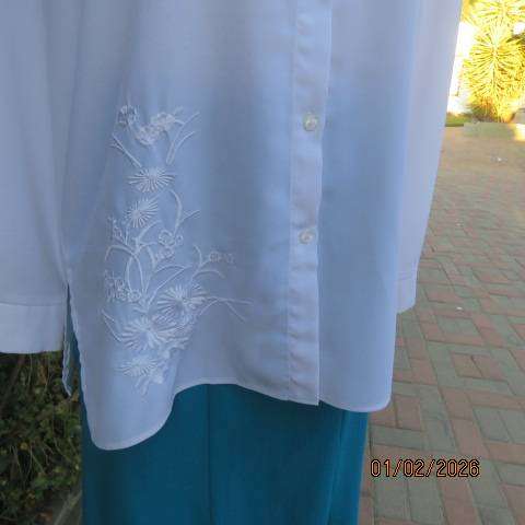 White high quality long sleeve textured polyester blouse button down .Front embroidery. Size 42