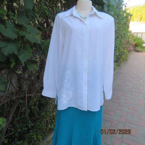 White high quality long sleeve textured polyester blouse button down .Front embroidery. Size 42