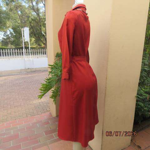 Rust colour button-down long sleeve polyester dress with open collar and fabric belt, size 34