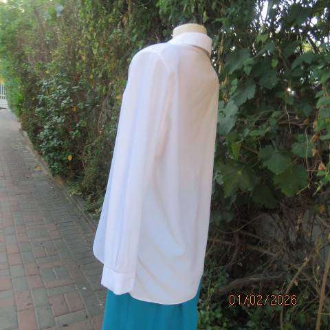 White high quality long sleeve textured polyester blouse button down .Front embroidery. Size 42