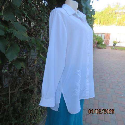 White high quality long sleeve textured polyester blouse button down .Front embroidery. Size 42