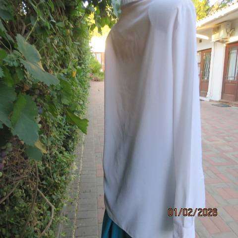 White high quality long sleeve textured polyester blouse button down .Front embroidery. Size 42