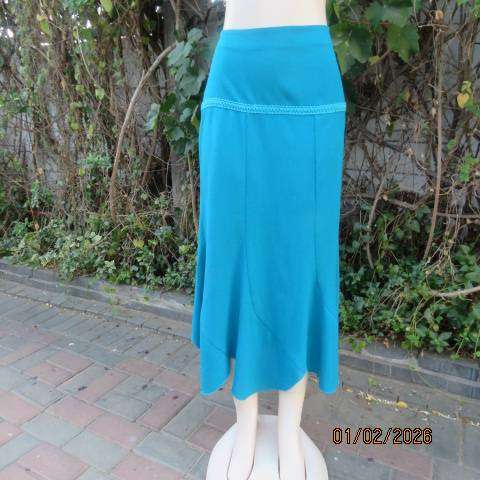 RENE TAYLOR jade skirt with asymmetrical seamline. Wide yoked front with panels. Size 42.