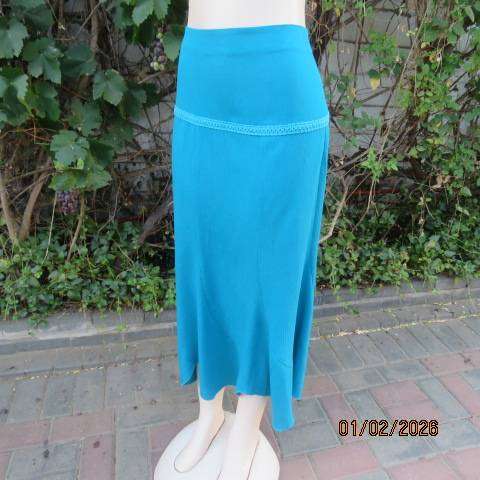RENE TAYLOR jade skirt with asymmetrical seamline. Wide yoked front with panels. Size 42.