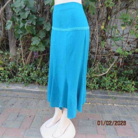 RENE TAYLOR jade skirt with asymmetrical seamline. Wide yoked front with panels. Size 42.