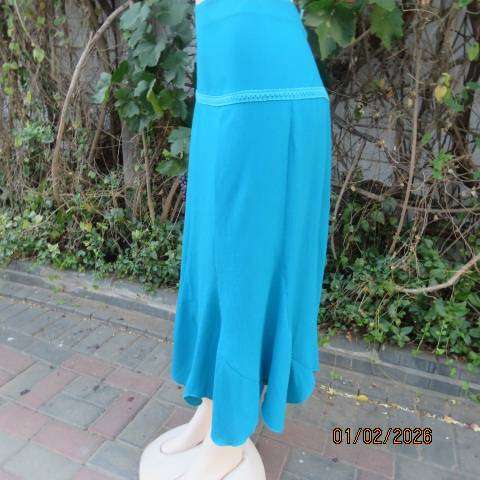 RENE TAYLOR jade skirt with asymmetrical seamline. Wide yoked front with panels. Size 42.