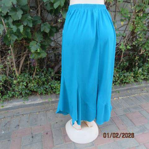 RENE TAYLOR jade skirt with asymmetrical seamline. Wide yoked front with panels. Size 42.