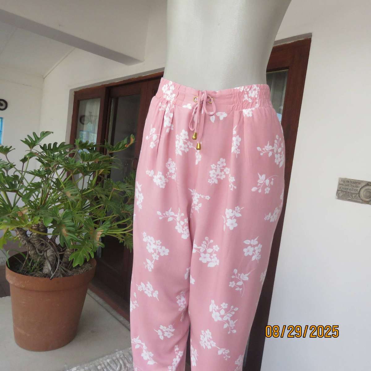 Salmon pink viscose pants with white floral pants. Elasticated waist. Size 40