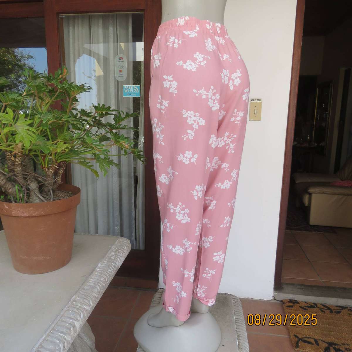 Salmon pink viscose pants with white floral pants. Elasticated waist. Size 40