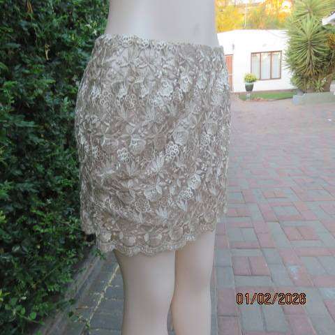 Ecru colour bridal satin boutique made mini skirt with thick polyester lace overlay. Size 36