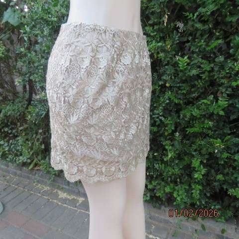 Ecru colour bridal satin boutique made mini skirt with thick polyester lace overlay. Size 36