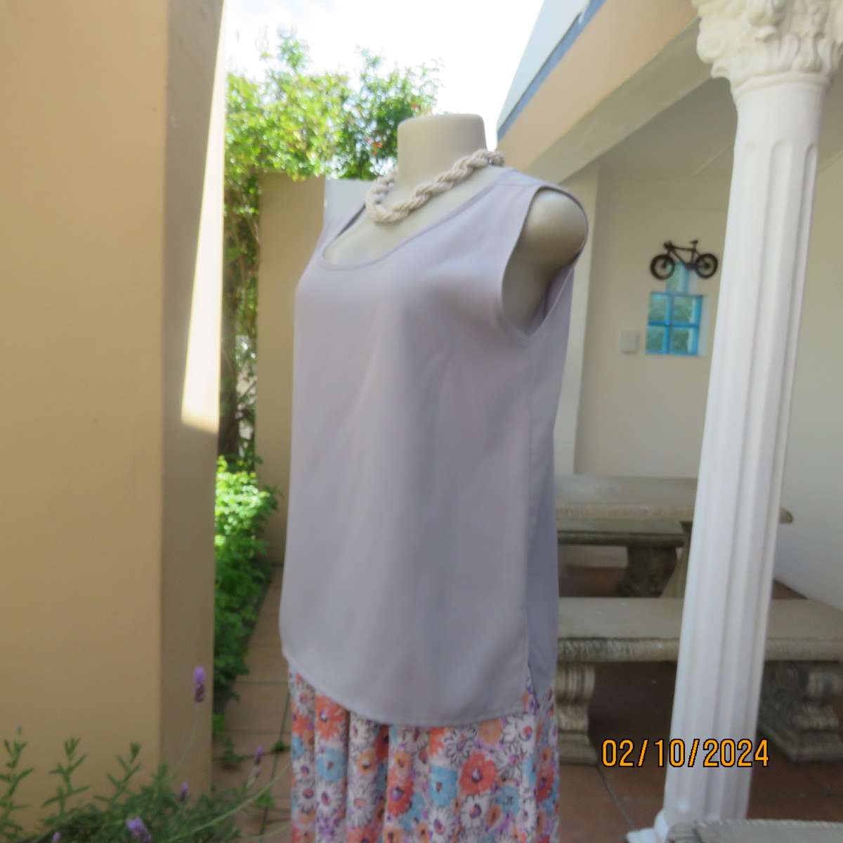 Owner made dusty lilac sleeveless cami style slip over polyester top. Size 36.