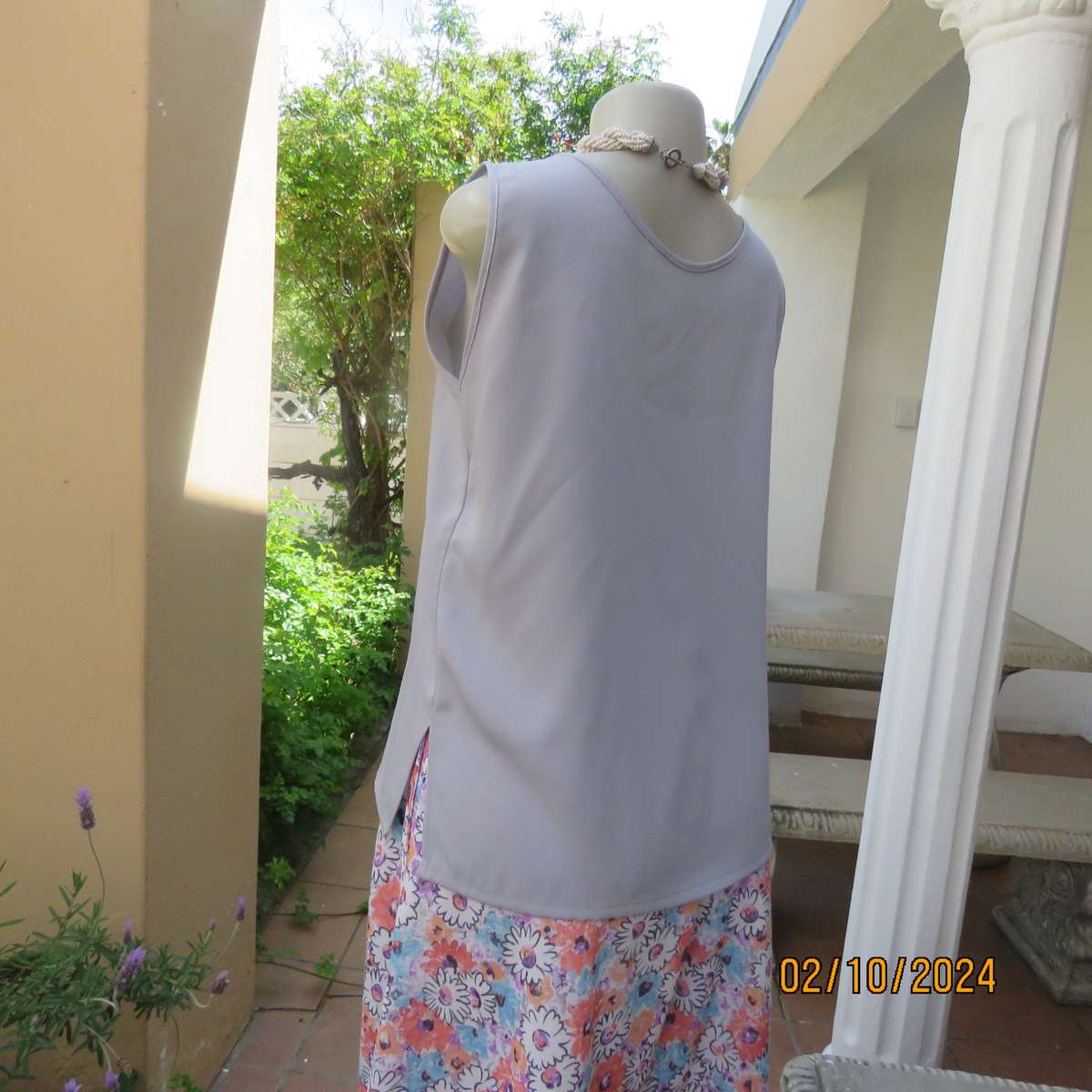 Owner made dusty lilac sleeveless cami style slip over polyester top. Size 36.