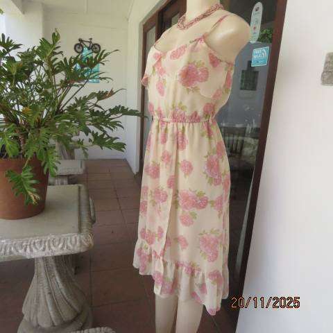 Rich cream with soft pink floral print strappy dress. Polyester stretch lining. Size 36