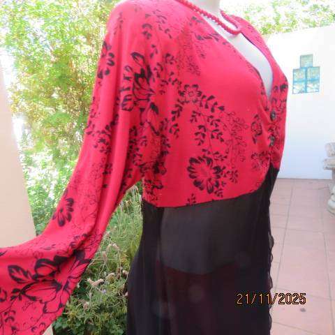 Red long sleeve with black floral print with long sheer black bottom. Size 42-44