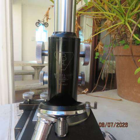 Vintage Bausch & Lomb monocular microscope model DD887 with extra eye pieces from USA