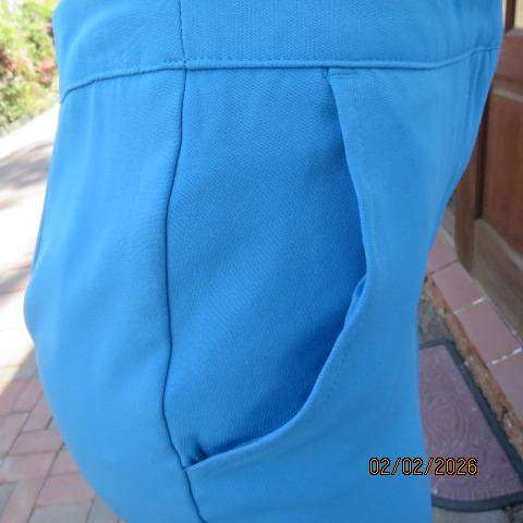 MISS L blue ankle length high waist stretch polyester bootlegged pants. Size 34
