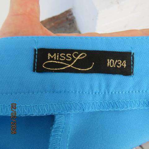 MISS L blue ankle length high waist stretch polyester bootlegged pants. Size 34