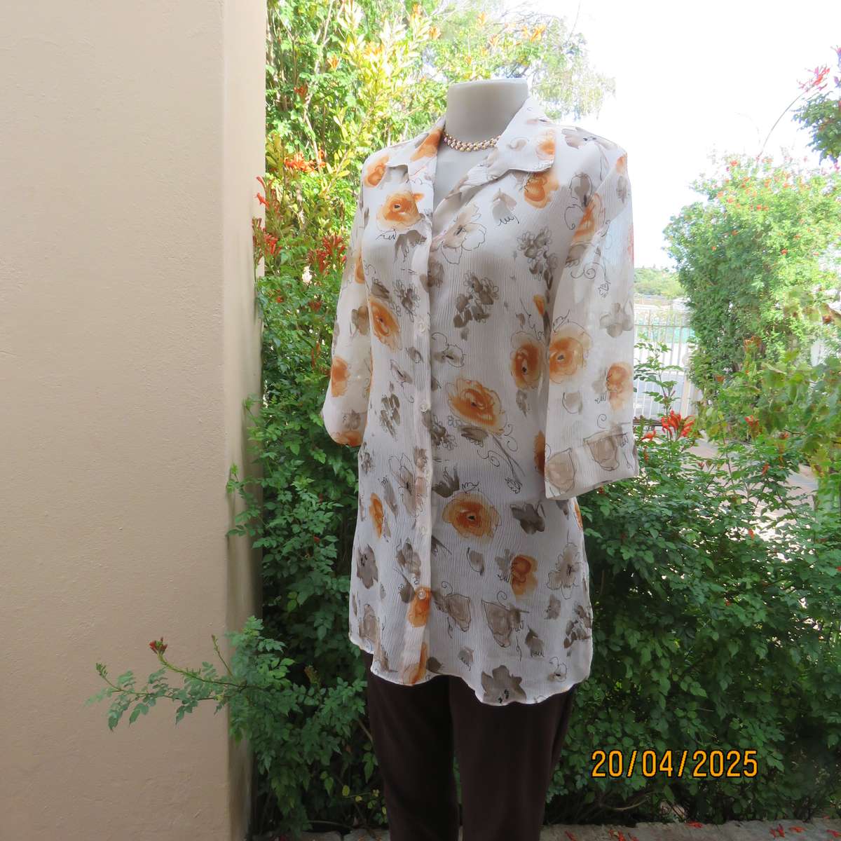 ZOEY long button down crinkled polyester top with open collar. Cream-orange flowers. Size 34