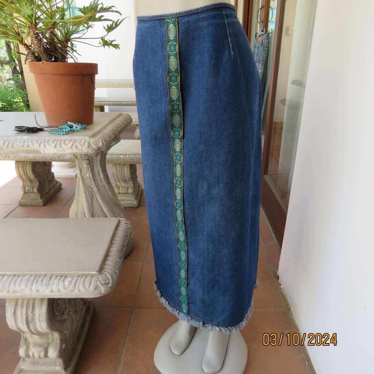 Blue 100% heavy cotton denim jean skirt size 44. Front decoration. Zip at back. Size 44. Good cond.