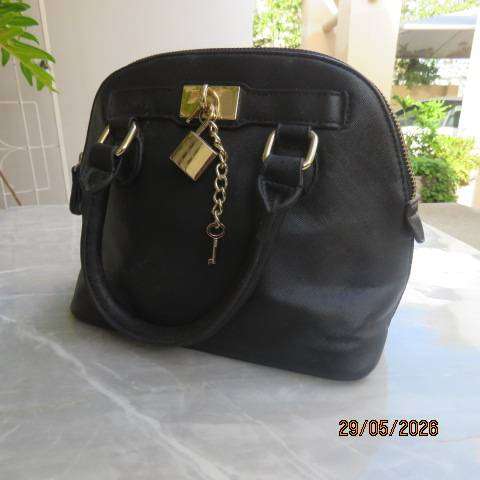 ALDO black hand-sling bag with zip-up closure and gilded lock and key. Never used