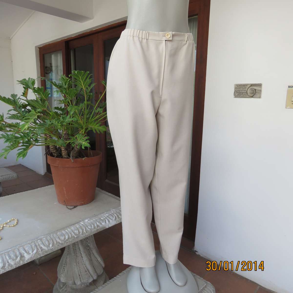 Boutique made mottled cream polyester pants.Tapered legs.Elasticated waist band.Size 40.As new