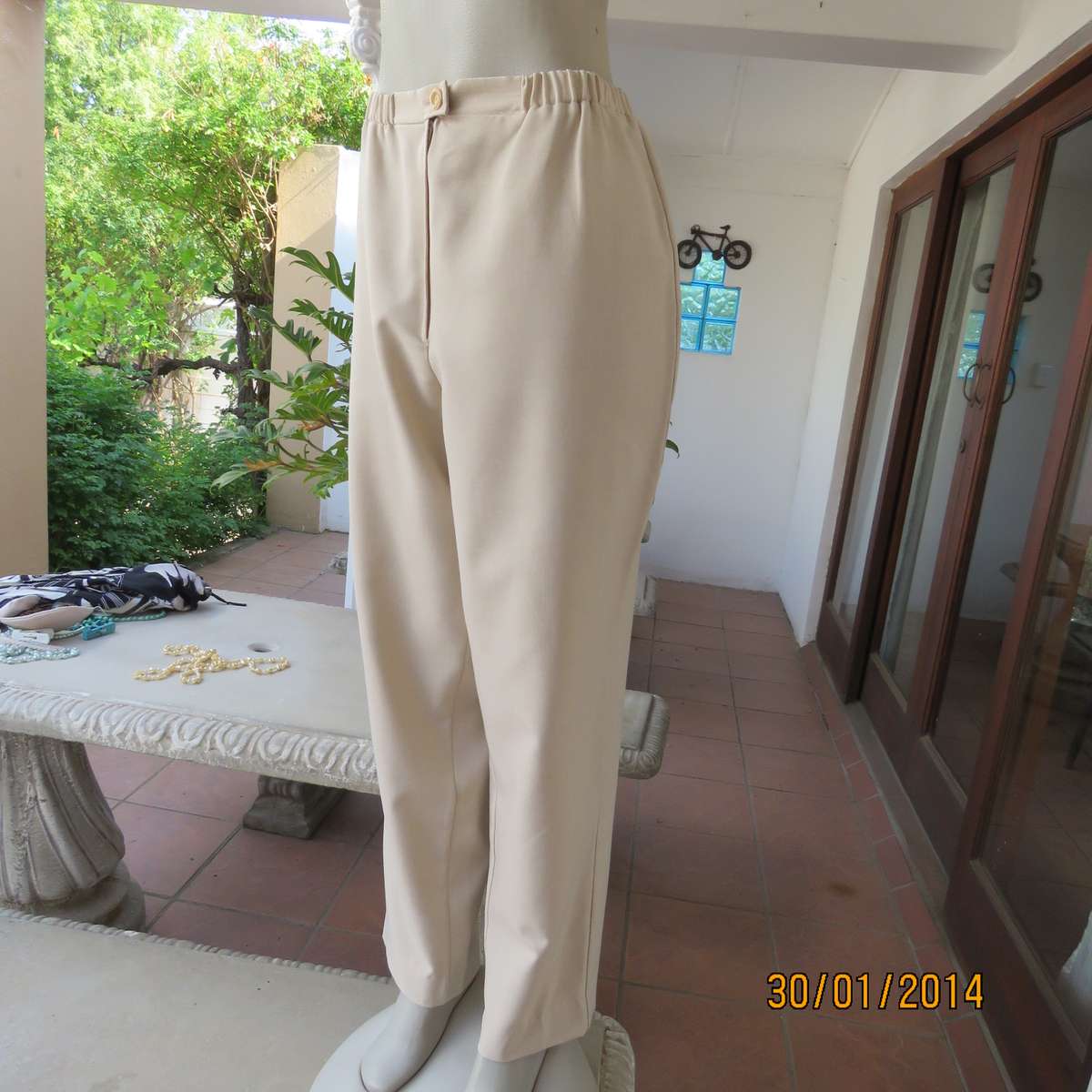 Boutique made mottled cream polyester pants.Tapered legs.Elasticated waist band.Size 40.As new