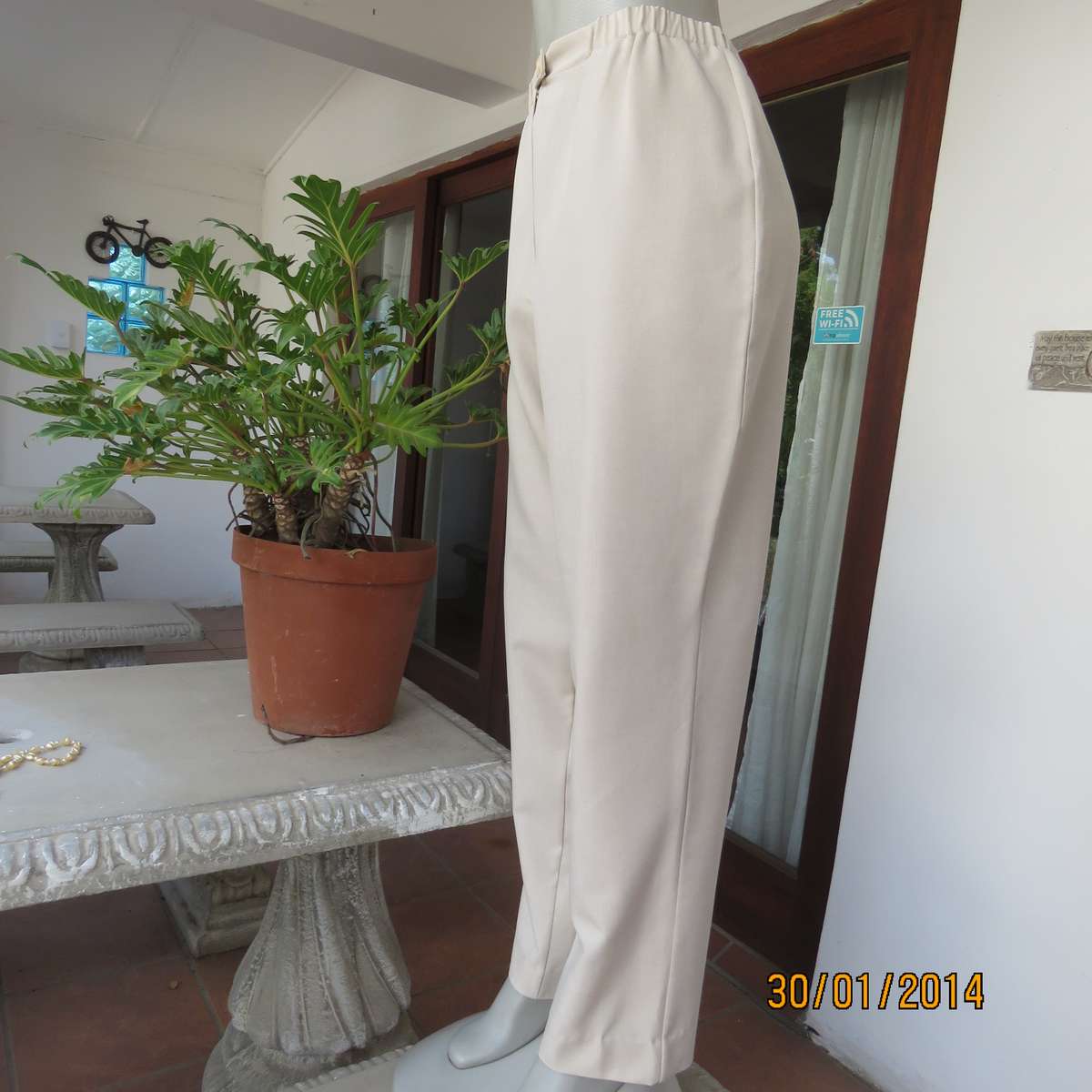 Boutique made mottled cream polyester pants.Tapered legs.Elasticated waist band.Size 40.As new