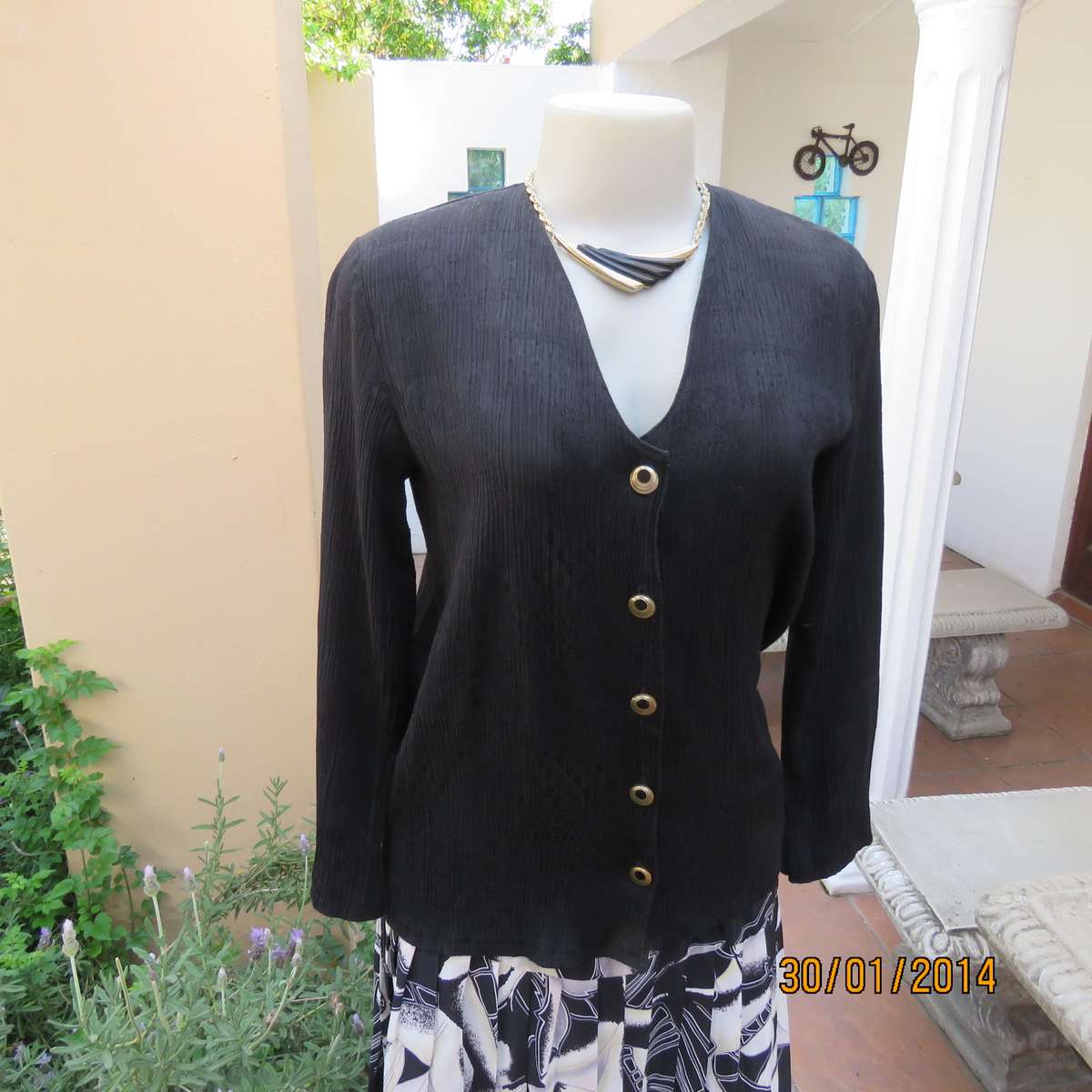 Black V neck button down long sleeve top in crinkled floral embossed polycotton. Size 34.