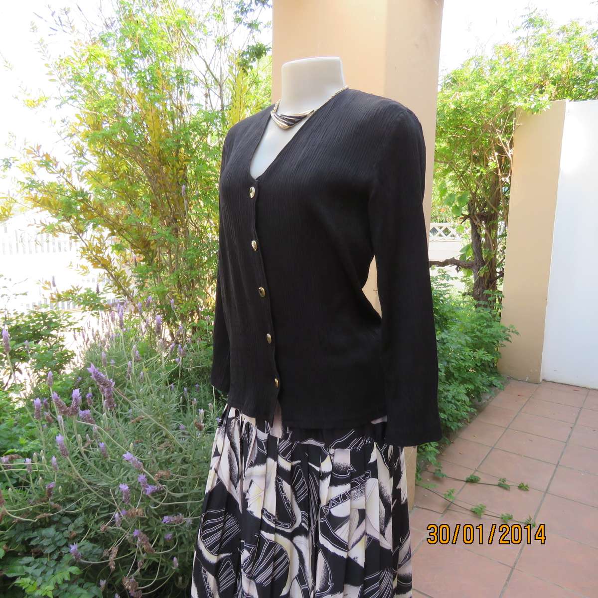Black V neck button down long sleeve top in crinkled floral embossed polycotton. Size 34.