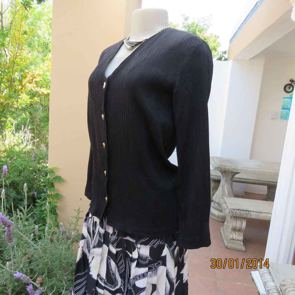 Black V neck button down long sleeve top in crinkled floral embossed polycotton. Size 34.