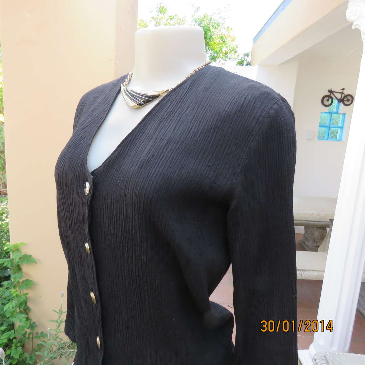 Black V neck button down long sleeve top in crinkled floral embossed polycotton. Size 34.