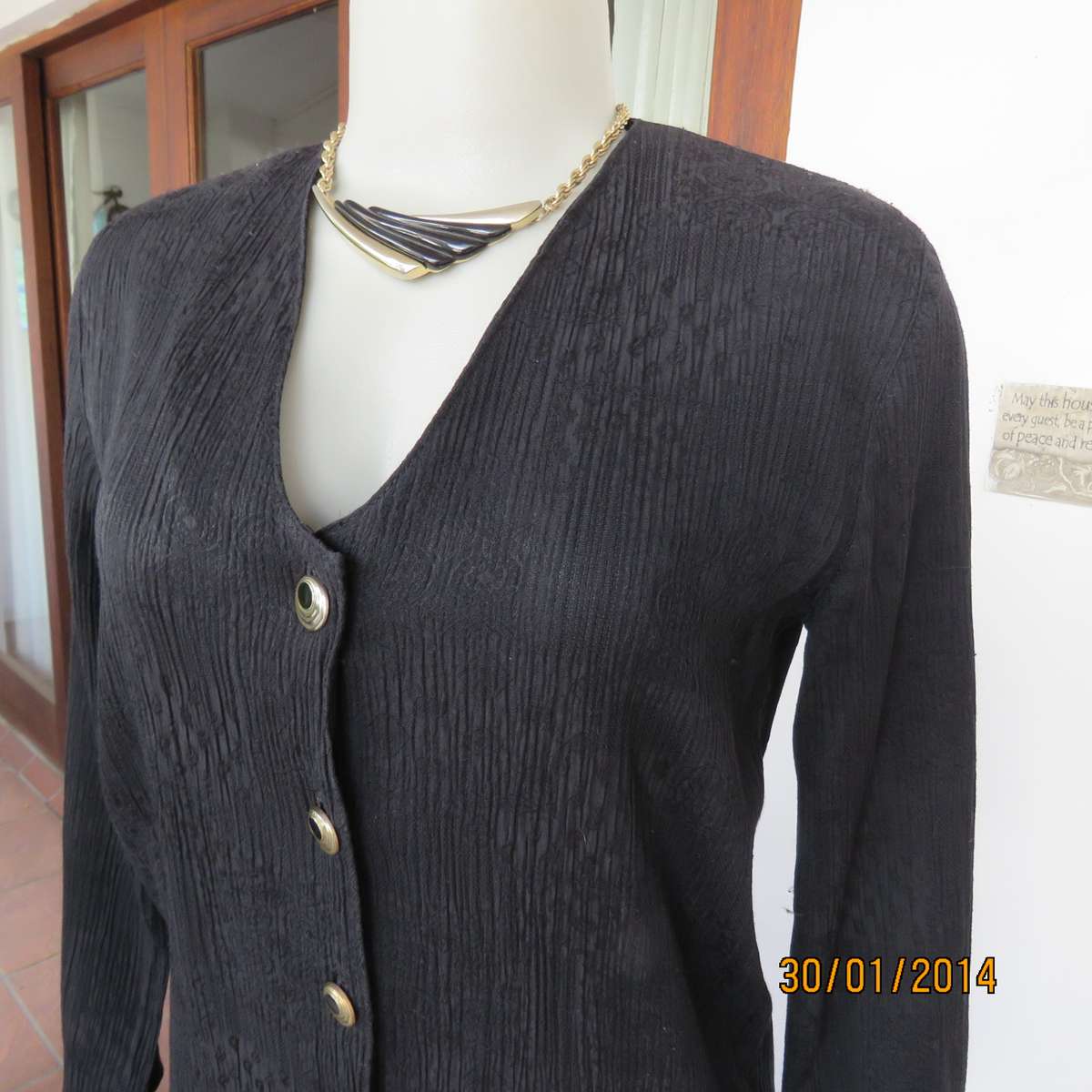 Black V neck button down long sleeve top in crinkled floral embossed polycotton. Size 34.